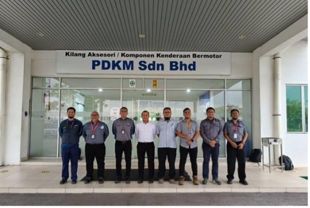 Group photograph with PDKM Sdn Bhd staff outside the plant